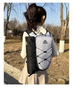 Lightweight sports running backpack with grid pattern, water bottle pocket and cords.
