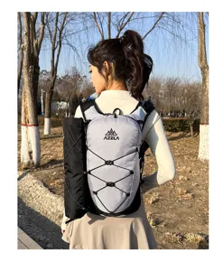 Detail view of the lightweight outdoor running backpack with grid pattern and hydration pocket.