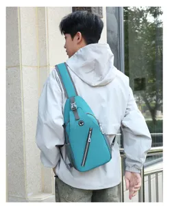 Detail view of a men's stylish chest sling bag in teal, worn on the back for active wear.