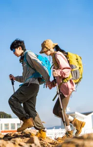Detailed outdoor scene featuring large capacity hiking backpack in action during a trekking trip.