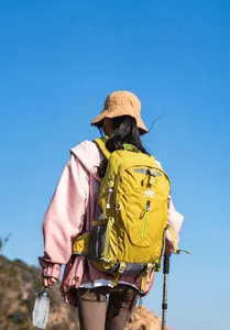Outdoor hiking backpack detail view showcasing external webbing system and attachment loops.