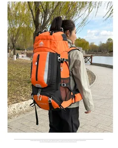 Outdoor hiking backpack detail view showing orange water-resistant fabric and straps.