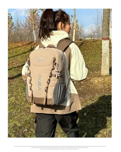 Outdoor hiking backpack detail view, featuring durable khaki fabric, multi-attachment straps.