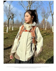 Outdoor hiking backpack and color-blocked jacket set for multi-functional travel and sports use.