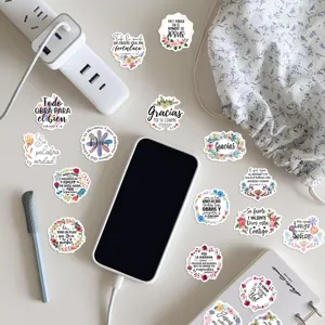 Detail view of waterproof Spanish religious quote stickers, perfect for DIY water bottle decor.