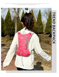 Pink outdoor hydration backpack detail, running cycling sports bag with mesh straps and cords.