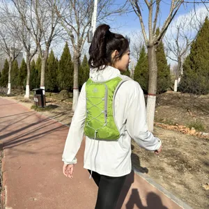 Green outdoor hydration backpack for running, cycling, and mountain climbing with elastic cords.