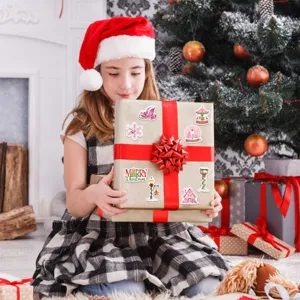 Adorables autocollants imperméables de Noël roses pour coques de téléphone, valises et carnets.