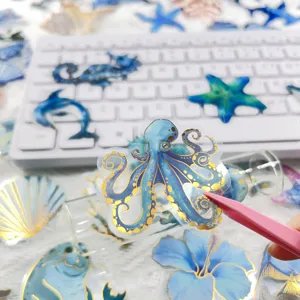 Gold stamped transparent PET journaling stickers featuring ocean animals detail show.