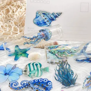 Waterproof transparent PET journal stickers featuring gold-stamped marine life designs.