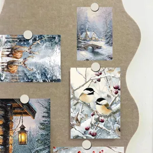Winter aesthetic wall art cards detail display showcasing cozy snow scenery prints on felt board.