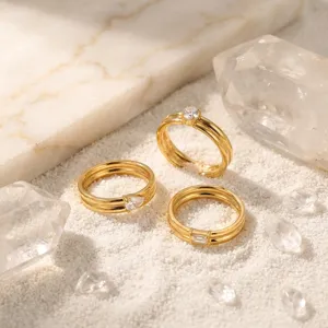 Exquisite French stackable gold rings featuring sparkling main stones, elegant minimalist daily jewelry details.