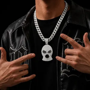 Close-up of icy hip-hop ski mask pendant necklace with full rhinestones and detailed design.