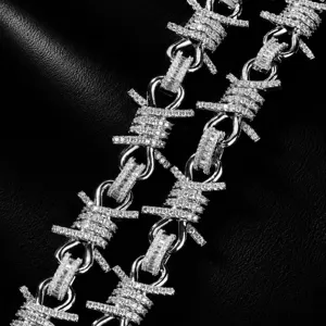 Close-up detail of hip-hop punk style diamond-paved barbed wire chain men's jewelry.