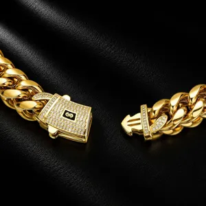 Gold Cuban link chain necklace detail with paved zircon lock clasp for men fashion jewelry.