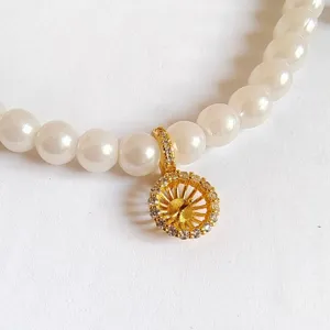 Detailed close-up view of DIY jewelry accessory pearl chain with gold micro-set zircon clasp.