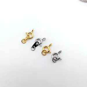 Detailed view of various metal spring clasps and lobster claws for jewelry making and repair.