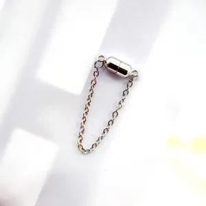 Stainless steel magnetic clasp detail shot, secure jewelry fastener for necklaces, bracelets.