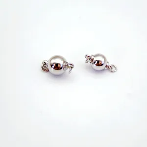 Close-up view of silver-tone ball screw clasps, perfect for DIY jewelry making and crafting details.
