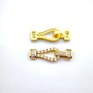 Gold plated horseshoe jewelry clasp with sparkling cubic zirconia for DIY necklaces.