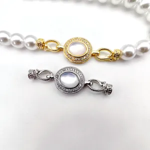 DIY pearl necklace clasp set with mother of pearl and zircon stone inlaid details close up