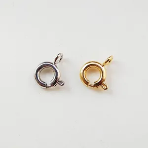 Metal jewelry spring clasps for necklaces and bracelets DIY making, detail view of gold and silver.
