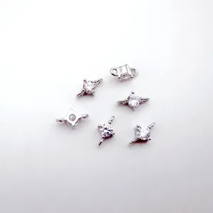 Close-up of DIY jewelry connectors with sparkling cubic zirconia, silver tone metal findings.