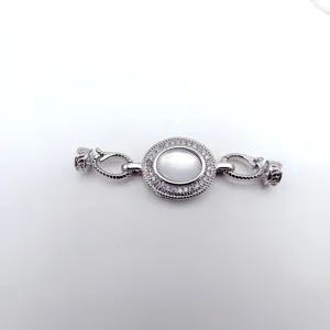 Detailed view of DIY silver necklace clasp with mother of pearl and crystal stones, durable design.