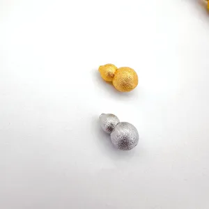 Gold and silver gourd screw clasp jewelry detail shot, perfect for necklace and bracelet making.