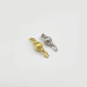 Detail shot of copper gold-plated lantern ball universal clasp for DIY bracelet necklace jewelry.