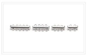 Detail view of multi strand tube clasps for DIY jewelry, silver tone slide locks for pearl necklaces.