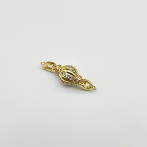 Exquisite gold-plated lantern ball jewelry clasp, detailed close-up of connector.