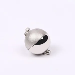 Close-up detail of silver magnetic ball clasp featuring half matte and half polished finish.
