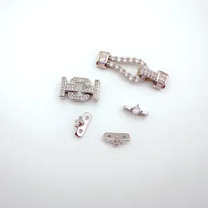 DIY jewelry findings set including cubic zirconia horseshoe clasp and H-shaped lock for pearl bracelets.
