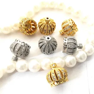 Detailed shot of crown shaped rhinestone jewelry bead caps and DIY necklace pendant findings.