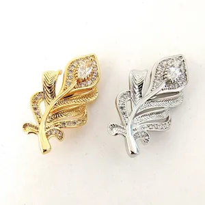 Close-up of delicate micro-pave feather jewelry clasp, sparkling zircon details for necklace design.