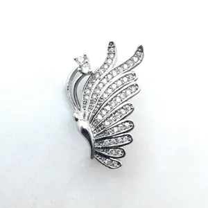 Close-up detail of silver paved rhinestone feather necklace clasp jewelry accessory component.