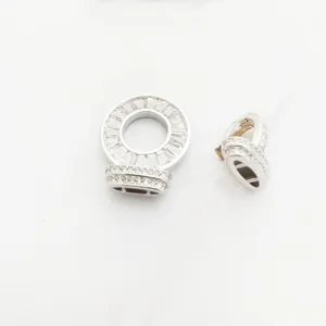 Closeup of DIY silver jewelry clasp detail inlaid with baguette and round zircons clearly.