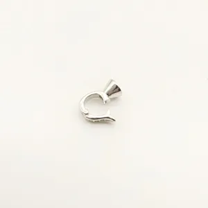 Close-up detail of silver-colored DIY jewelry clasp connector for pearl necklaces and bracelets.