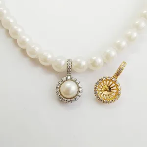 Close-up detail of DIY jewelry making finding pendant clasp with sparkling cubic zirconia.
