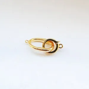 Close-up of gold metal jewelry clasp, ideal for DIY necklaces and bracelets connector.
