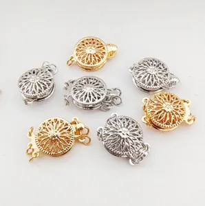 Close-up detail of golden and silver floral pearl necklace clasps, DIY jewelry accessories.