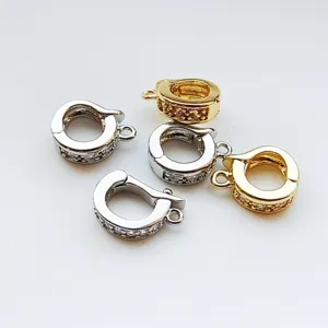 Close-up detail of DIY jewelry clasps, gold and silver plated connector buckles for pearl necklaces.