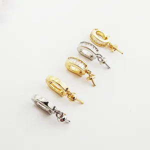 Close-up view of DIY copper plated zircon jewelry bail connector pendant tray for necklace DIY.