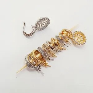 Detail view of DIY copper gold plated zirconia jewelry clasp bail findings for necklace making.