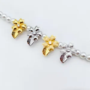 DIY brushed flower leaf necklace clasp detail showing gold and silver pearl sweater chain buckle design.