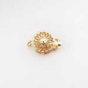 Close-up detail of a gold-plated copper sunflower jewelry clasp for DIY bracelets and necklaces.