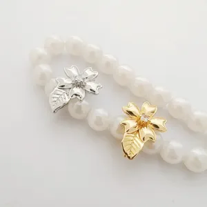 DIY pearl necklace clasp accessory with dual silver and gold flower leaf design.
