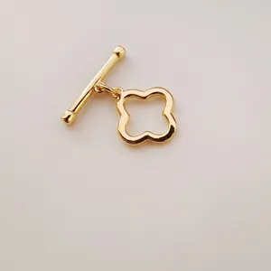 Gold-plated metal clover toggle clasp detail, handmade jewelry connecting accessory part.