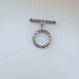 Metal OT toggle clasp detail view, silver braided design for handmade pearl necklaces and bracelets.